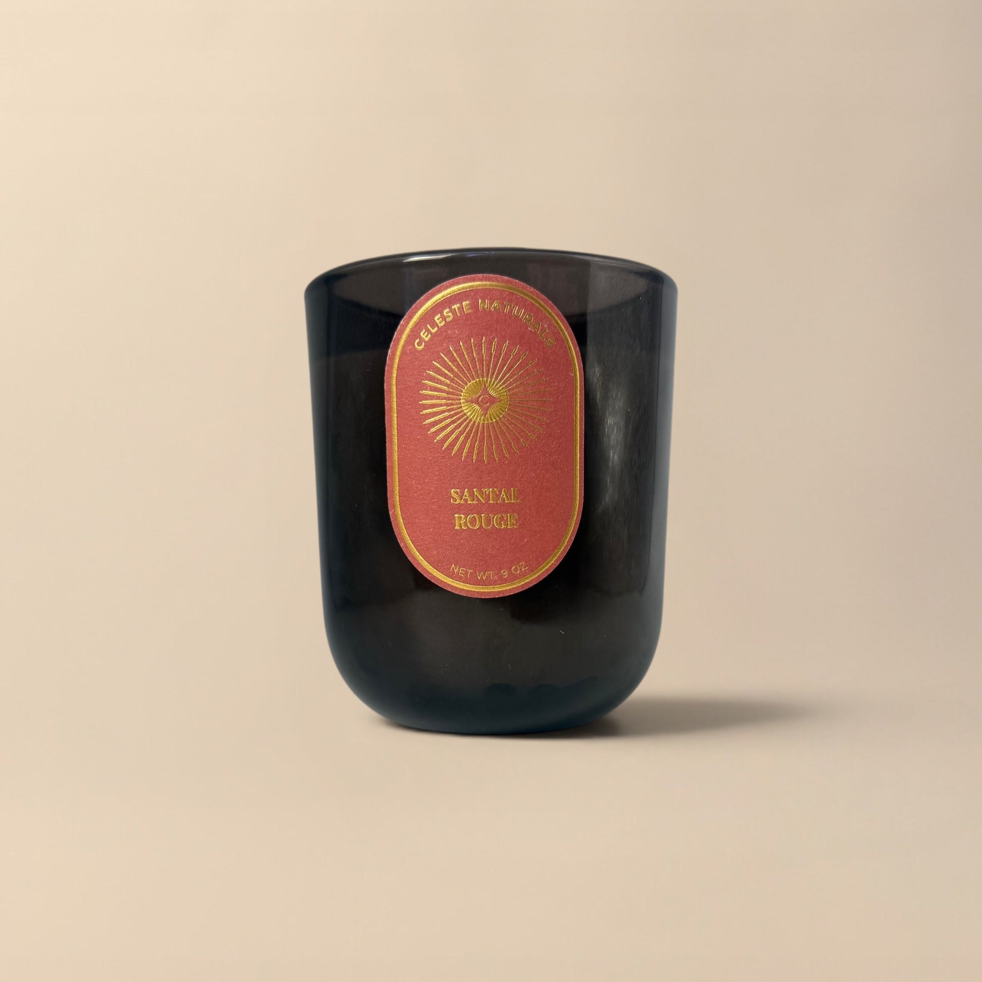 Celeste Naturals Santal Rouge Candle in dark amber jar