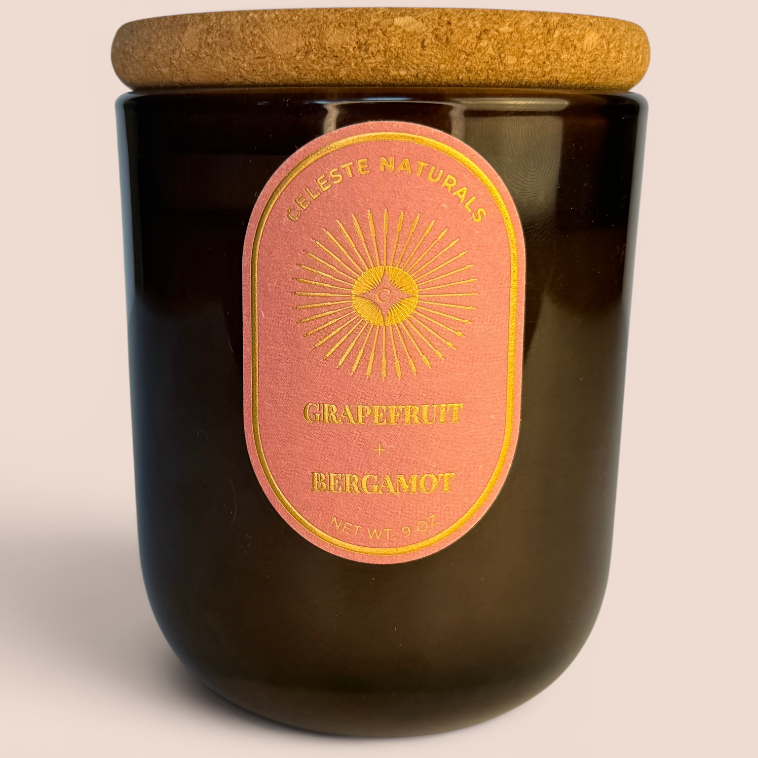 Celeste Naturals Grapefruit + Bergamot candle with cork lid on a beige background