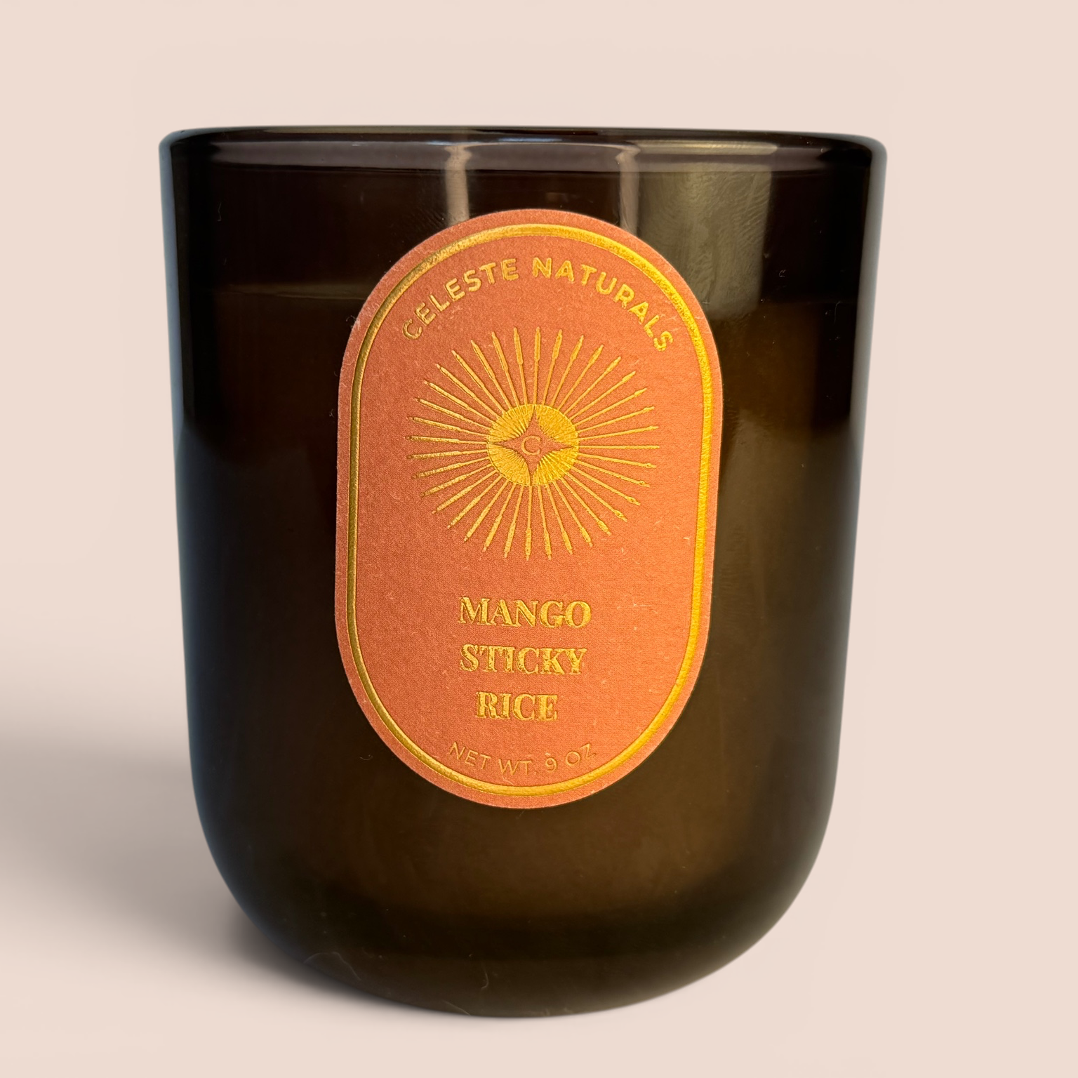 CELESTE NATURALS Mango Sticky Rice candle on beige background