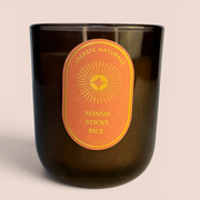 CELESTE NATURALS Mango Sticky Rice candle on beige background