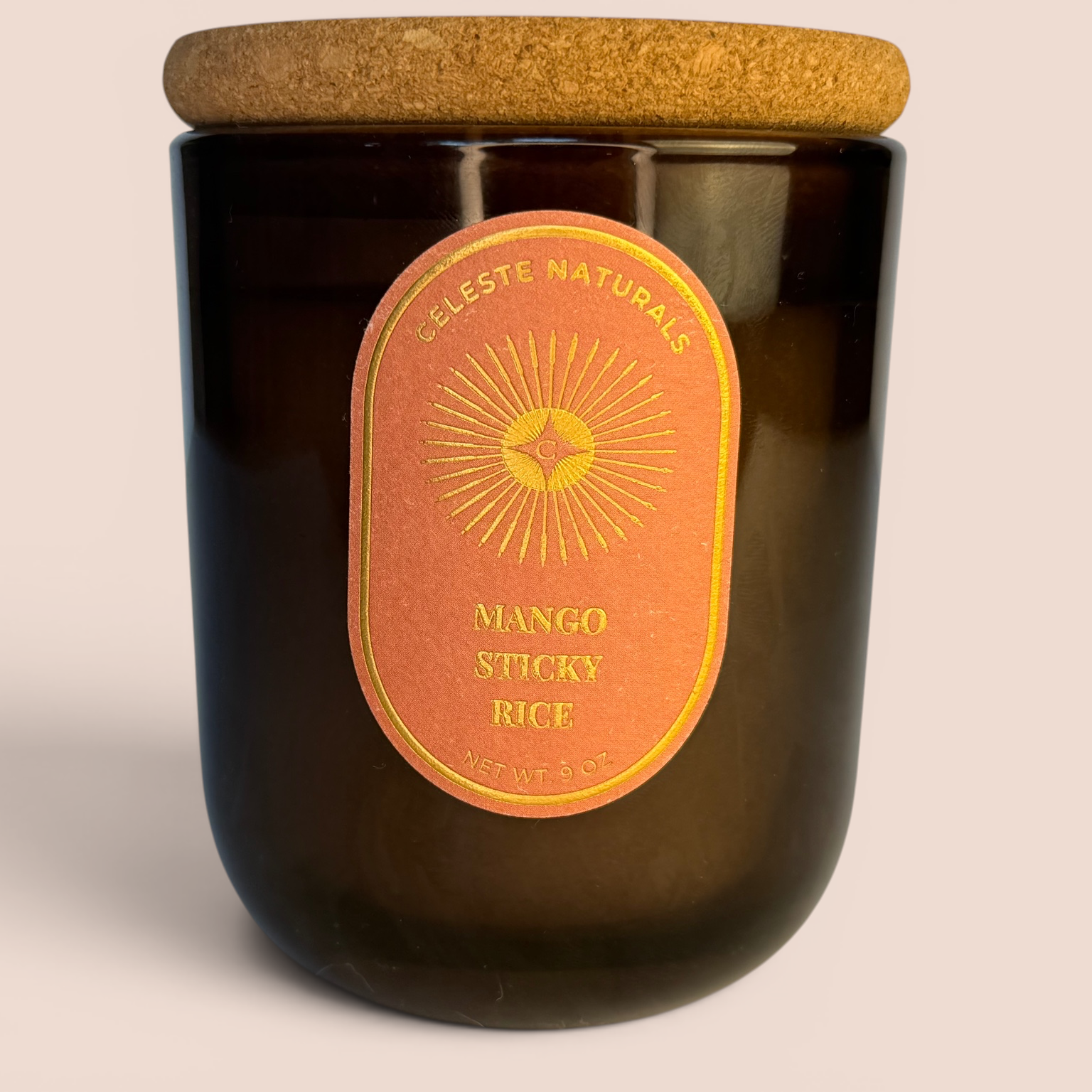 CELESTE NATURALS Mango Sticky Rice Candle with cork lid on beige background