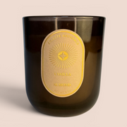 Celeste Naturals Vanilla + Almond candle in an amber jar