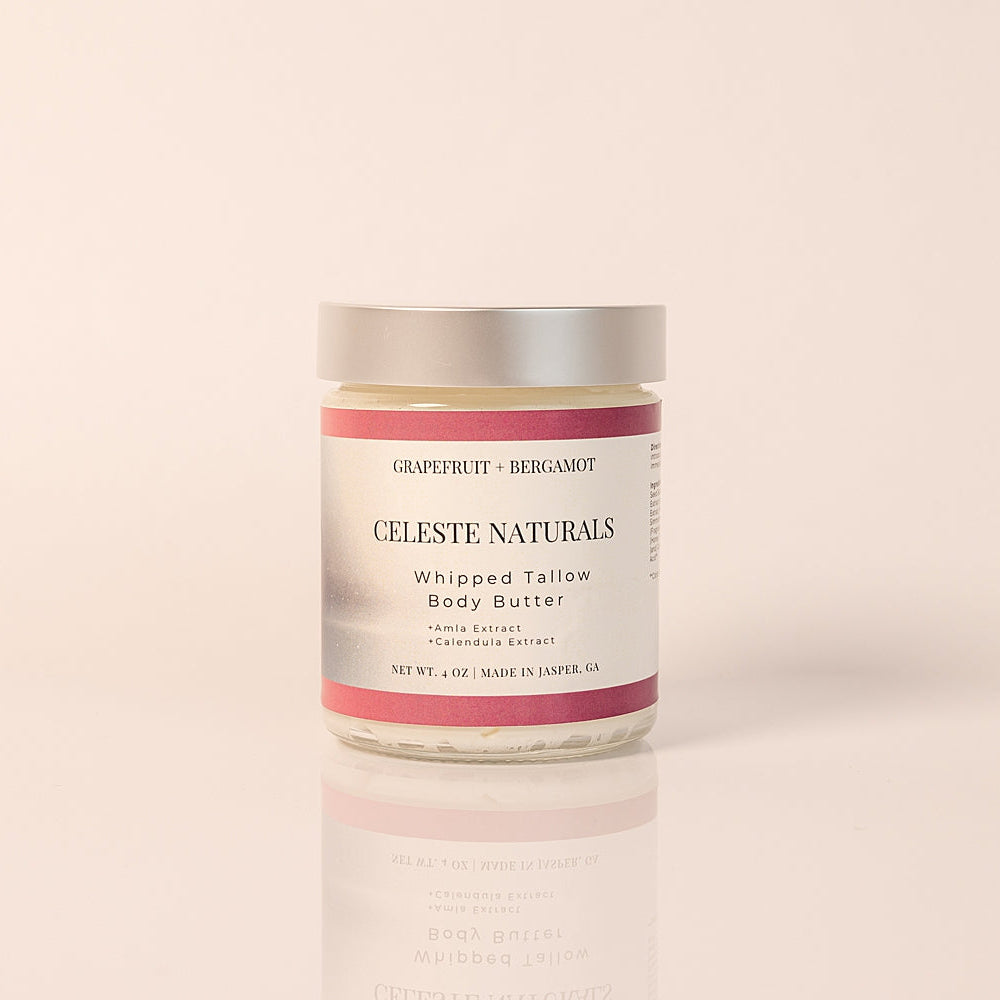 CELESTE NATURALS GRAPEFRUIT + BERGAMOT whipped tallow body butter jar on a beige background