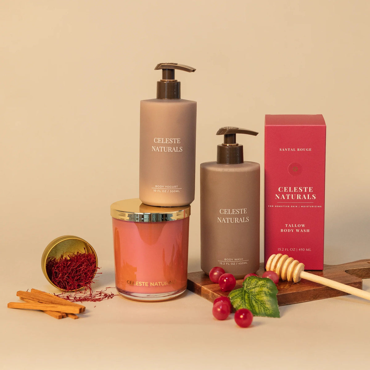 Celeste Naturals Santal Rouge Body Wash, Body Yogurt, and candle in a pink iridescent vessel with gold lid