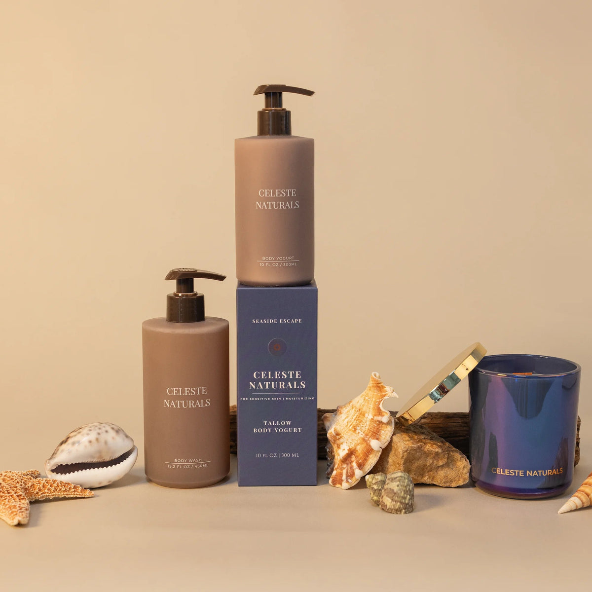 Celeste Naturals Seaside Escape Body Wash, Body Yogurt, and candle in blue iridescent vessel with gold lid and blue box